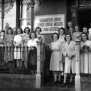 View showing a group of women standing outside the front door of Salvation Army Tower House Hostel for Girls, 1 Wellington Street, Launceston, Tasmania, c 1944.